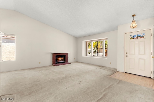 433 Old Palms Dr, Las Vegas, NV 89123 - unfurnished living room featuring carpet flooring, vaulted ceiling, and a fireplace