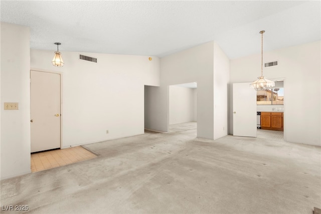 433 Old Palms Dr, Las Vegas, NV 89123 - unfurnished living room featuring high vaulted ceiling, light carpet, and a chandelier