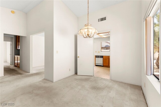433 Old Palms Dr, Las Vegas, NV 89123 - unfurnished dining area with a high ceiling, light carpet, and a chandelier