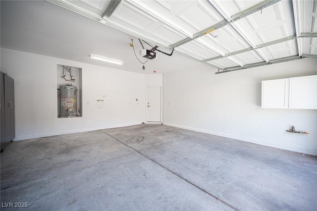 6029 Allanche Ave, Las Vegas, NV 89141 - garage with gas water heater, a garage door opener, and baseboards