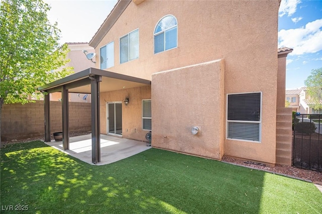 6029 Allanche Ave, Las Vegas, NV 89141 - back of house featuring stucco siding and a patio