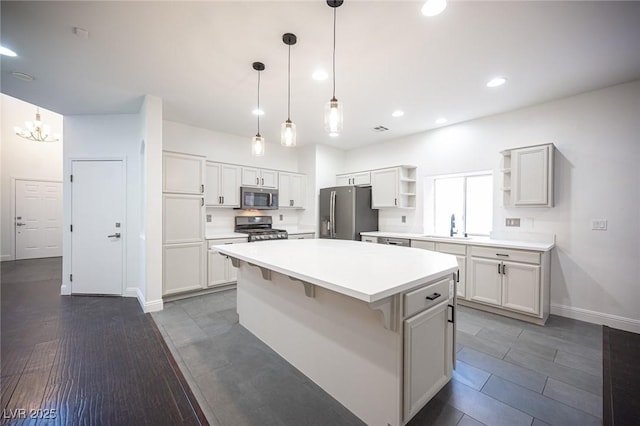 6029 Allanche Ave, Las Vegas, NV 89141 - kitchen featuring stainless steel appliances, open shelves, a sink, baseboards, and light countertops