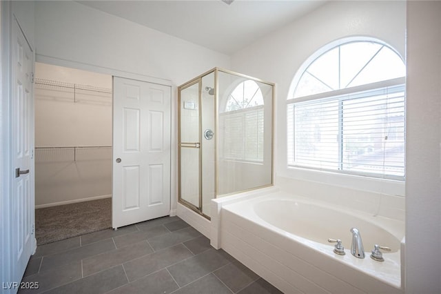 6029 Allanche Ave, Las Vegas, NV 89141 - bathroom with a stall shower, a bath, tile patterned flooring, and a spacious closet