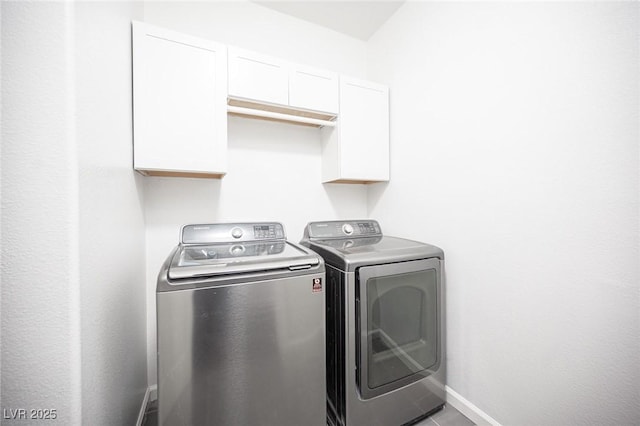 6029 Allanche Ave, Las Vegas, NV 89141 - laundry room with washing machine and clothes dryer, cabinet space, and baseboards
