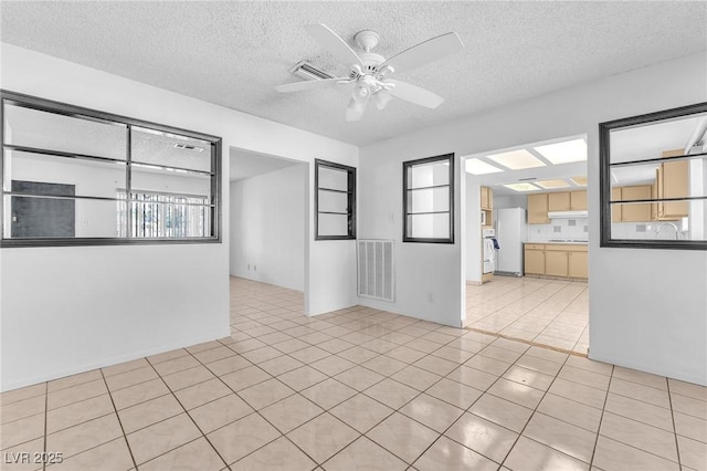 4386 El Cebra Way, Las Vegas, NV 89121 - empty room featuring ceiling fan, a textured ceiling, and light tile patterned flooring