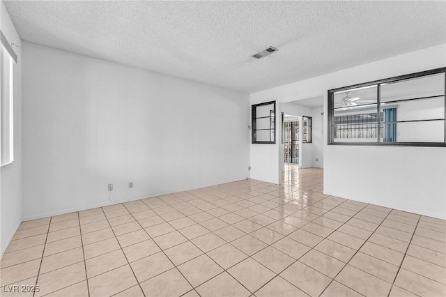 4386 El Cebra Way, Las Vegas, NV 89121 - empty room featuring a textured ceiling and light tile patterned flooring
