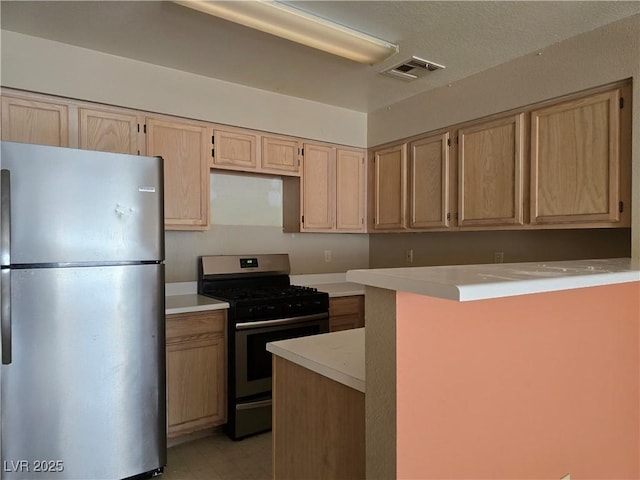 2116 Bavington Dr Unit C, Las Vegas, NV 89108 - kitchen featuring stainless steel appliances, light brown cabinets, light countertops, and light flooring