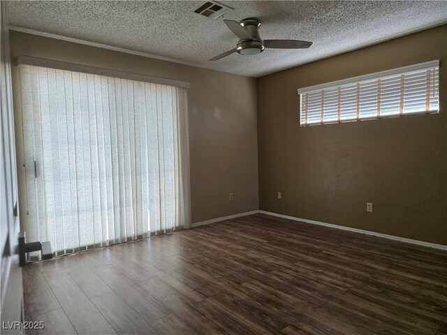 2116 Bavington Dr Unit C, Las Vegas, NV 89108 - spare room with a ceiling fan, dark wood finished floors, a textured ceiling, and baseboards