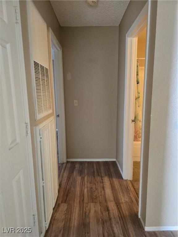 2116 Bavington Dr Unit C, Las Vegas, NV 89108 - hallway with wood finished floors, baseboards, and a textured ceiling