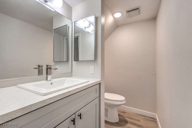 3683 Villa Knolls E Dr, Las Vegas, NV 89120 - bathroom featuring vanity, toilet, wood finished floors, and baseboards