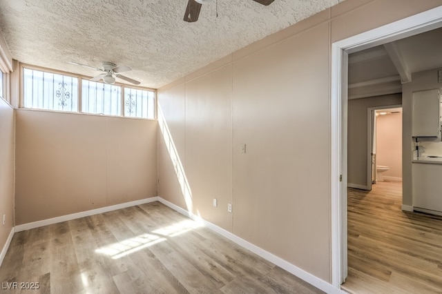 3683 Villa Knolls E Dr, Las Vegas, NV 89120 - unfurnished room featuring a ceiling fan, wood finished floors, baseboards, and a textured ceiling