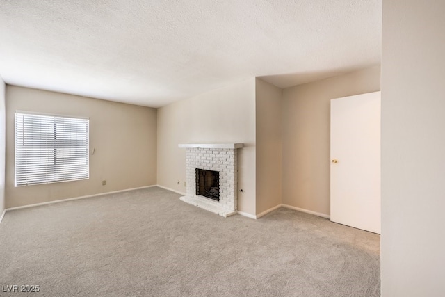 3683 Villa Knolls E Dr, Las Vegas, NV 89120 - unfurnished living room with carpet, a fireplace, a textured ceiling, and baseboards