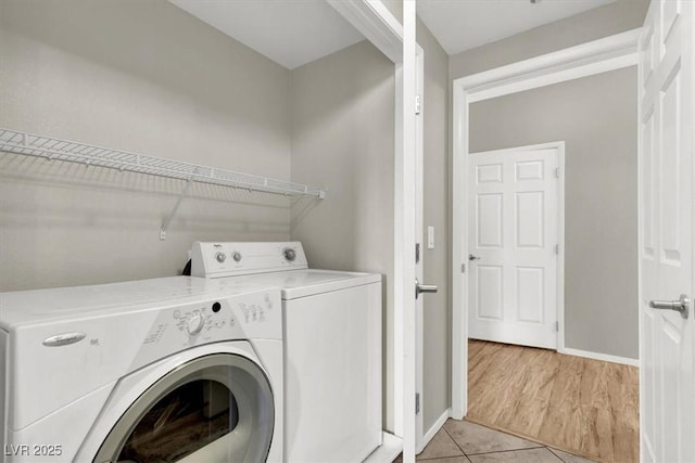 50 Aura De Blanco St Unit 18204, Henderson, NV 89074 - laundry room with independent washer and dryer, light tile patterned flooring, and baseboards