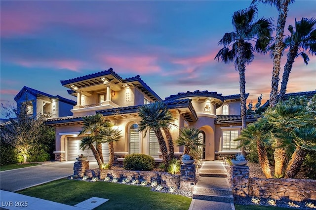 1972 Alcova Ridge Dr, Las Vegas, NV 89135 - mediterranean / spanish-style home featuring an attached garage, stucco siding, and concrete driveway