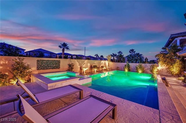 1972 Alcova Ridge Dr, Las Vegas, NV 89135 - pool at dusk featuring a fenced backyard, a pool with connected hot tub, and a patio