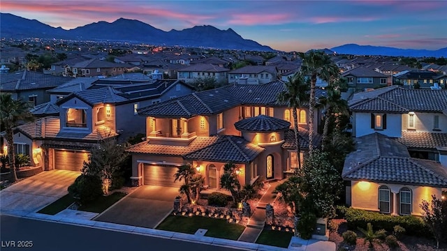 1972 Alcova Ridge Dr, Las Vegas, NV 89135 - mediterranean / spanish home with a residential view, a mountain view, a garage, and driveway