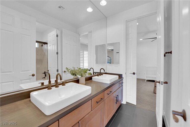 1972 Alcova Ridge Dr, Las Vegas, NV 89135 - bathroom with double vanity, tile patterned floors, an enclosed shower, radiator heating unit, and recessed lighting