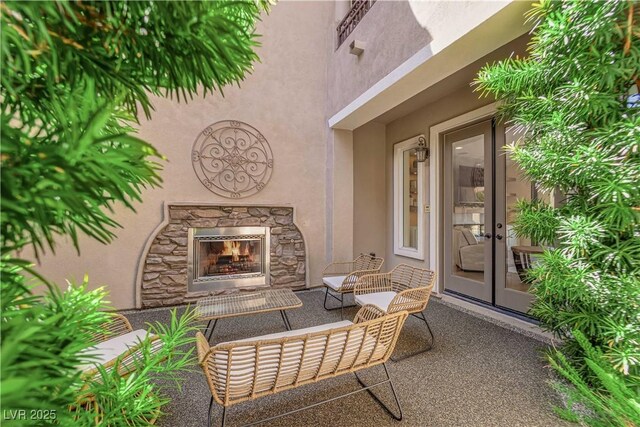 1972 Alcova Ridge Dr, Las Vegas, NV 89135 - view of patio / terrace featuring an outdoor stone fireplace and french doors