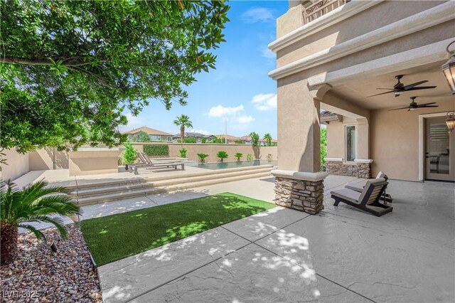 1972 Alcova Ridge Dr, Las Vegas, NV 89135 - fenced backyard featuring a patio area, a swimming pool, and a ceiling fan