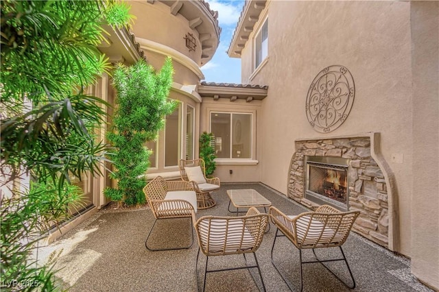 1972 Alcova Ridge Dr, Las Vegas, NV 89135 - view of patio / terrace featuring an outdoor stone fireplace