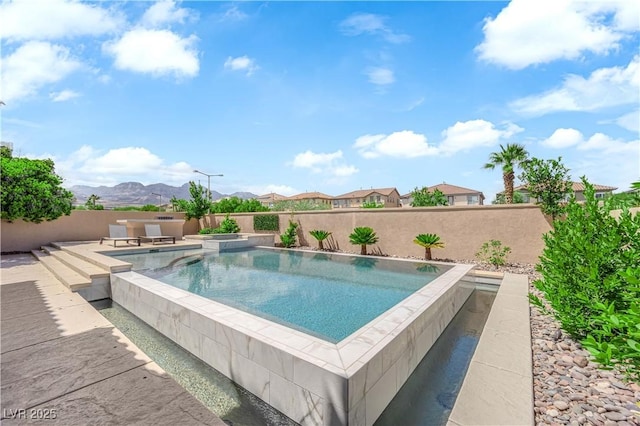 1972 Alcova Ridge Dr, Las Vegas, NV 89135 - view of swimming pool with a fenced backyard, a mountain view, and a patio area