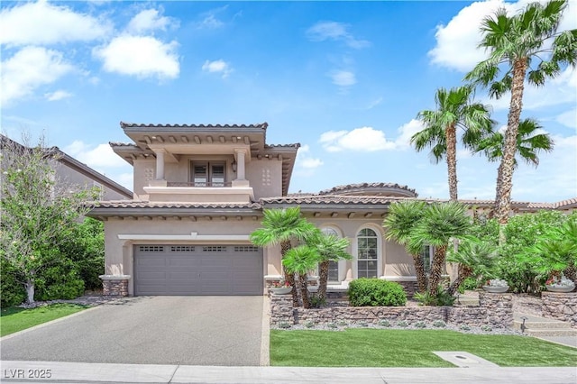 1972 Alcova Ridge Dr, Las Vegas, NV 89135 - mediterranean / spanish house with driveway, a balcony, stucco siding, a garage, and stone siding