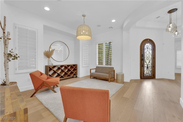 1972 Alcova Ridge Dr, Las Vegas, NV 89135 - entrance foyer featuring arched walkways, wood finished floors, baseboards, and recessed lighting
