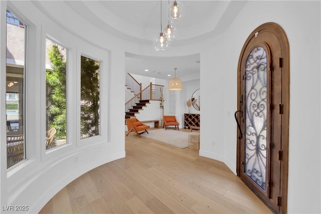 1972 Alcova Ridge Dr, Las Vegas, NV 89135 - foyer featuring healthy amount of natural light, light wood-style flooring, and arched walkways