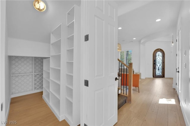 1972 Alcova Ridge Dr, Las Vegas, NV 89135 - walk in closet featuring light wood-style flooring and arched walkways