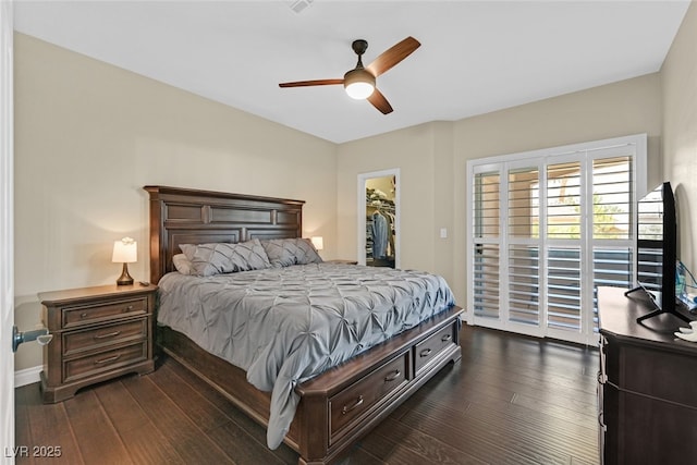 2050 W Warm Springs Rd Unit 823, Henderson, NV 89014 - bedroom featuring access to outside, dark wood finished floors, a walk in closet, ceiling fan, and a closet
