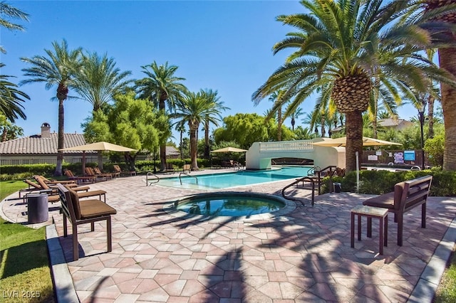 2050 W Warm Springs Rd Unit 823, Henderson, NV 89014 - community pool featuring a hot tub and a patio