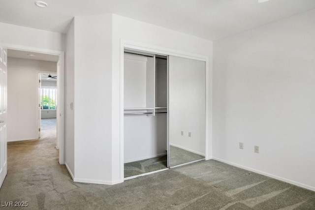 9524 Quail Ridge Dr, Las Vegas, NV 89134 - unfurnished bedroom featuring carpet, a closet, and baseboards