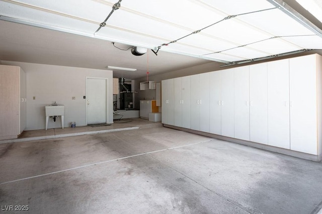 9524 Quail Ridge Dr, Las Vegas, NV 89134 - garage featuring a garage door opener and washer / clothes dryer