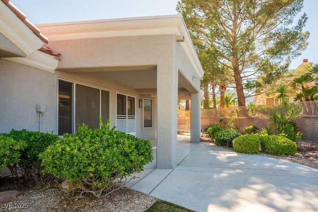 9524 Quail Ridge Dr, Las Vegas, NV 89134 - doorway to property featuring stucco siding and a patio area