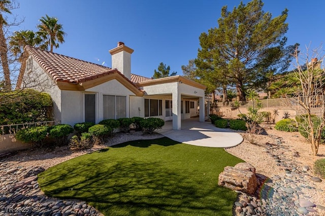 9524 Quail Ridge Dr, Las Vegas, NV 89134 - rear view of house featuring a chimney, stucco siding, a patio area, and a tile roof