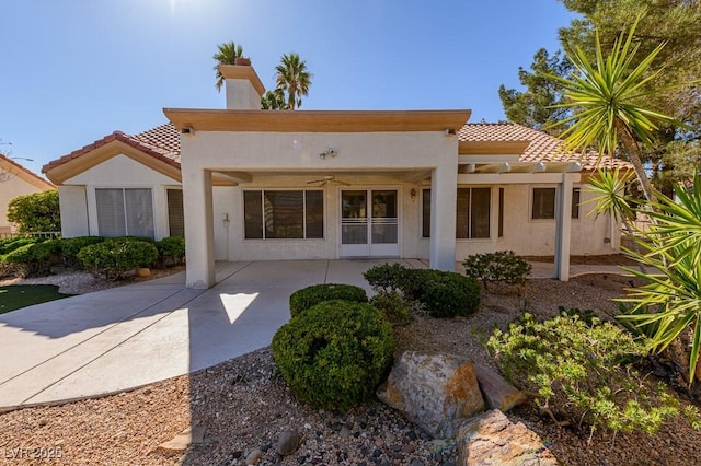 9524 Quail Ridge Dr, Las Vegas, NV 89134 - back of property with a tiled roof, a ceiling fan, stucco siding, and a patio