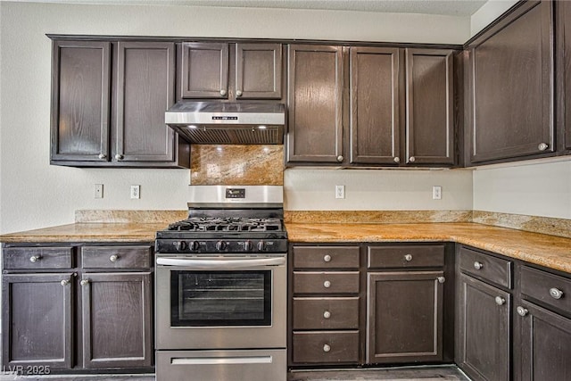 7083 Somera Way, Las Vegas, NV 89113 - kitchen featuring gas stove, under cabinet range hood, dark brown cabinetry, and light countertops