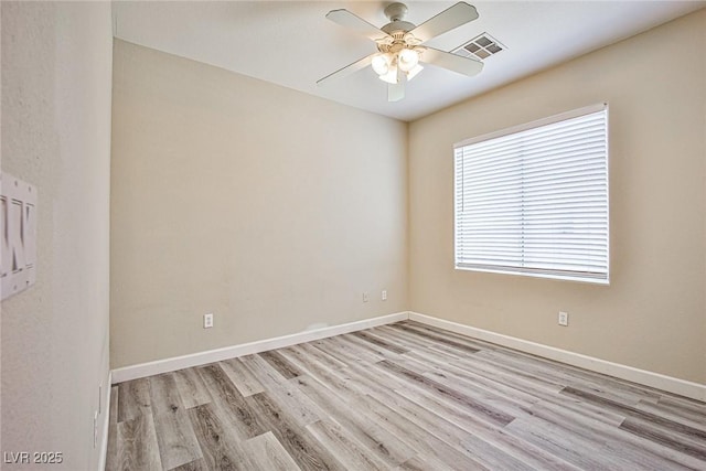 7083 Somera Way, Las Vegas, NV 89113 - spare room with a ceiling fan, wood finished floors, and baseboards