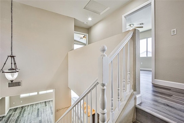 7083 Somera Way, Las Vegas, NV 89113 - stairs featuring wood finished floors, ceiling fan, baseboards, and a towering ceiling
