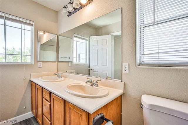 7083 Somera Way, Las Vegas, NV 89113 - full bath with toilet, a textured wall, double vanity, and baseboards