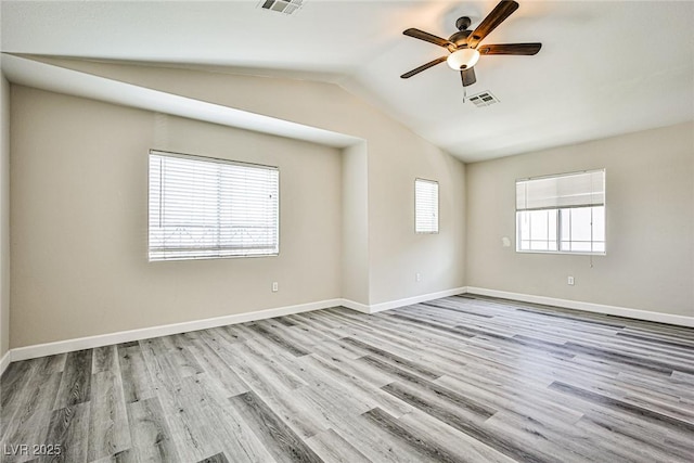 7083 Somera Way, Las Vegas, NV 89113 - spare room featuring ceiling fan, lofted ceiling, wood finished floors, and baseboards