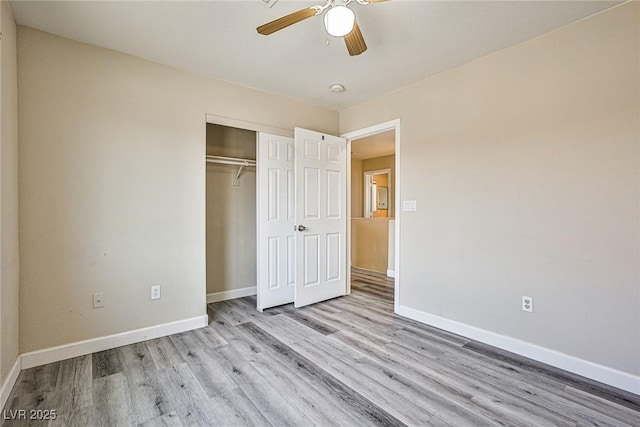 7083 Somera Way, Las Vegas, NV 89113 - unfurnished bedroom with wood finished floors, baseboards, a closet, and a ceiling fan