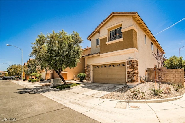 7083 Somera Way, Las Vegas, NV 89113 - view of front of home featuring an attached garage, stucco siding, concrete driveway, and stone siding