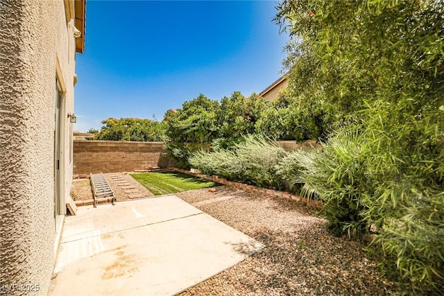 7083 Somera Way, Las Vegas, NV 89113 - fenced backyard with a patio area
