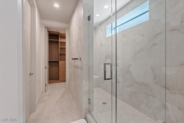40 Heron Harbour Dr, Henderson, NV 89011 - bathroom featuring a stall shower, recessed lighting, tile patterned flooring, and a walk in closet