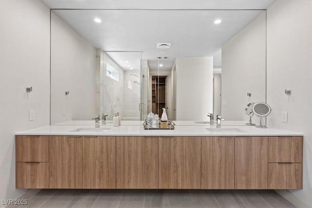 40 Heron Harbour Dr, Henderson, NV 89011 - full bath with double vanity, a stall shower, tile patterned floors, and recessed lighting