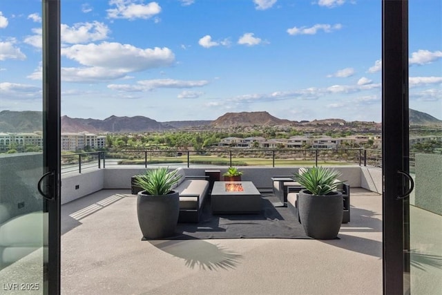 40 Heron Harbour Dr, Henderson, NV 89011 - view of patio / terrace featuring a fire pit and a mountain view