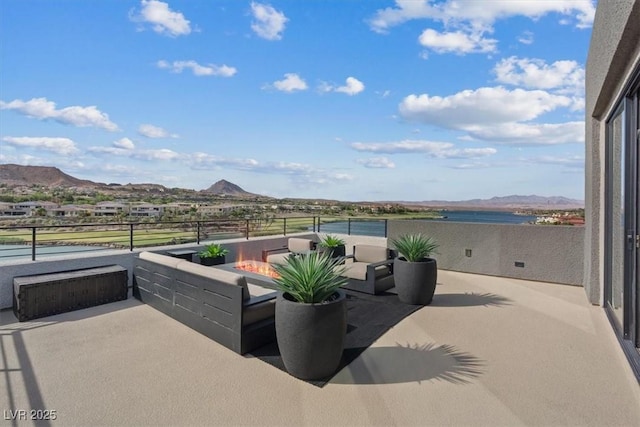 40 Heron Harbour Dr, Henderson, NV 89011 - view of patio / terrace featuring a mountain view and an outdoor living space with a fire pit