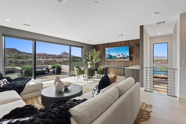 40 Heron Harbour Dr, Henderson, NV 89011 - living room featuring wooden walls and light tile patterned floors