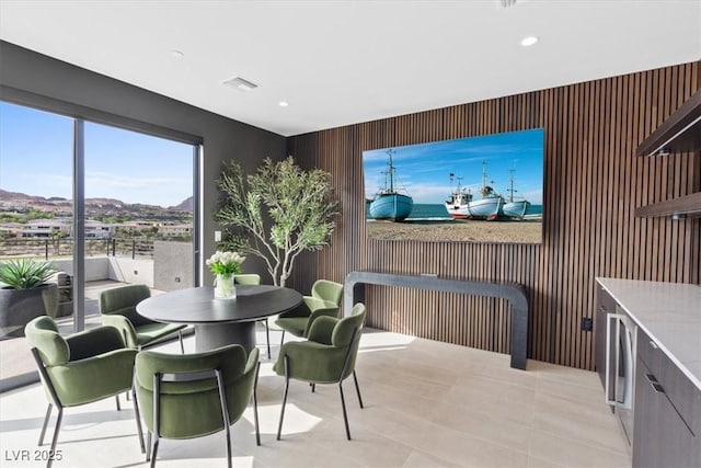 40 Heron Harbour Dr, Henderson, NV 89011 - dining room featuring wooden walls, recessed lighting, and an accent wall